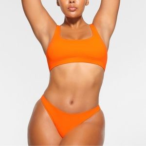 🧡SKIMS SWIM MID COVERAGE BIKINI BOTTOMS IN ORANGE XXS